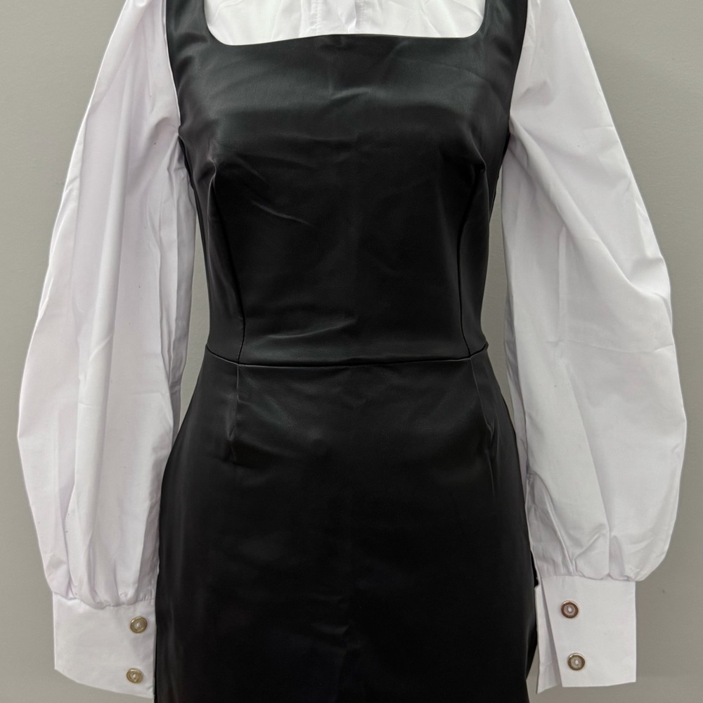 Elegant Black Dress with White Sleeves